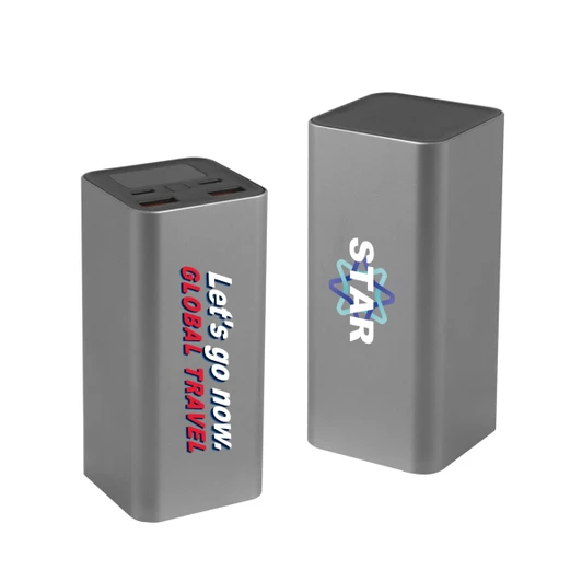 A grey power bank featuring multiple ports and a logo, designed for charging devices on the go.