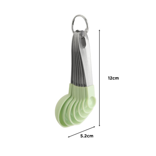 A set of measuring spoons in pastel green with a stainless steel ring for easy storage.