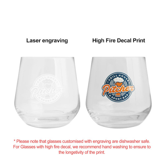 A wine glass featuring a laser-engraved design on one side and a coloured decal print on the other, both in clear glass.
