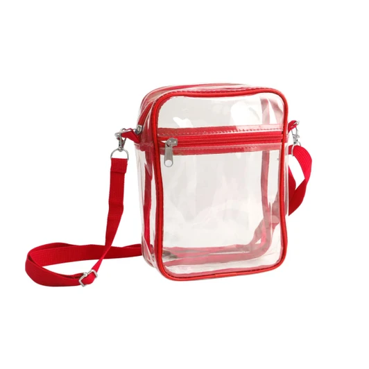 A clear tote bag with a red zipper closure and adjustable crossbody strap, featuring a transparent design.