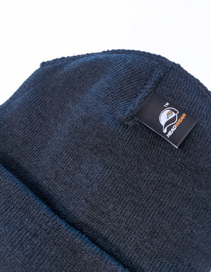 A black beanie with a folded cuff and a branded label on the side.