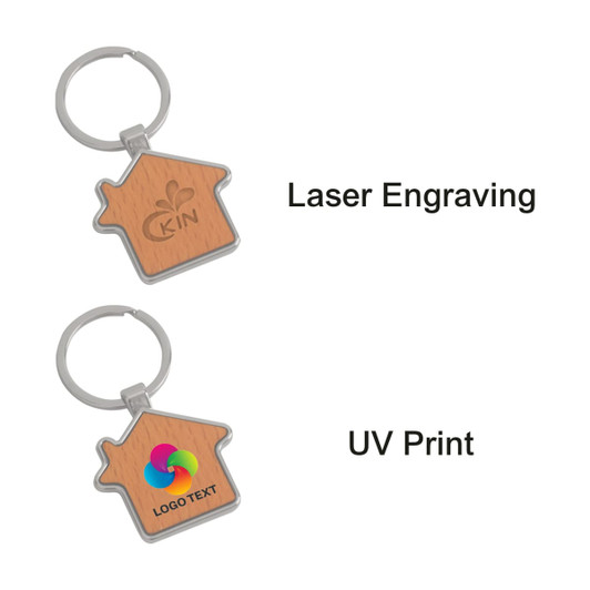 A wooden keyring shaped like a house, featuring a metal frame and a logo design on one side.