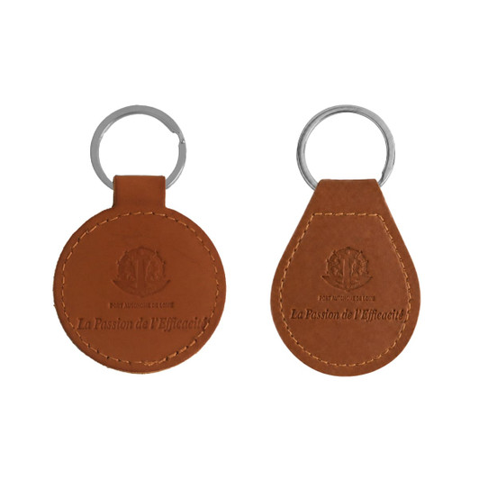 A brown PU leather keyring featuring a circular and a teardrop shape, both including a metal keyring attachment.
