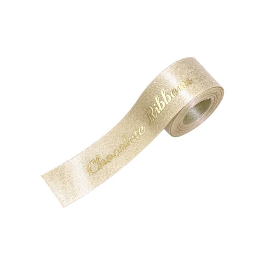 A roll of glitter gold satin ribbon with a shiny finish and a decorative text pattern.