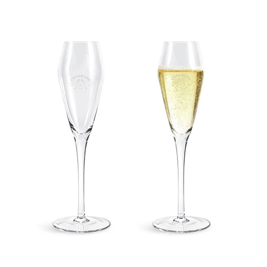A pair of clear tulip champagne glasses with one filled with sparkling beverage and a logo on the side.