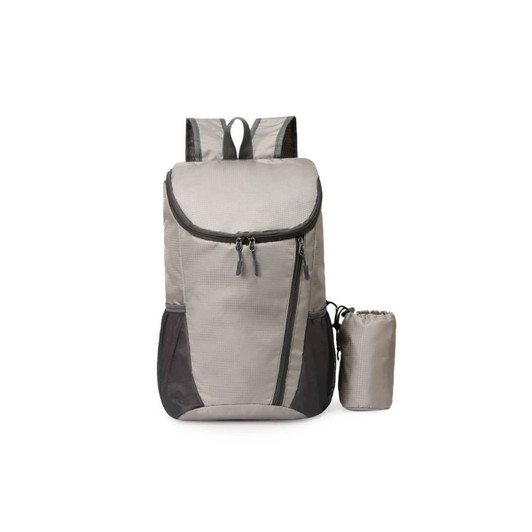 A packable travel backpack in grey with black accents and a small detachable pouch. It has a logo on it.