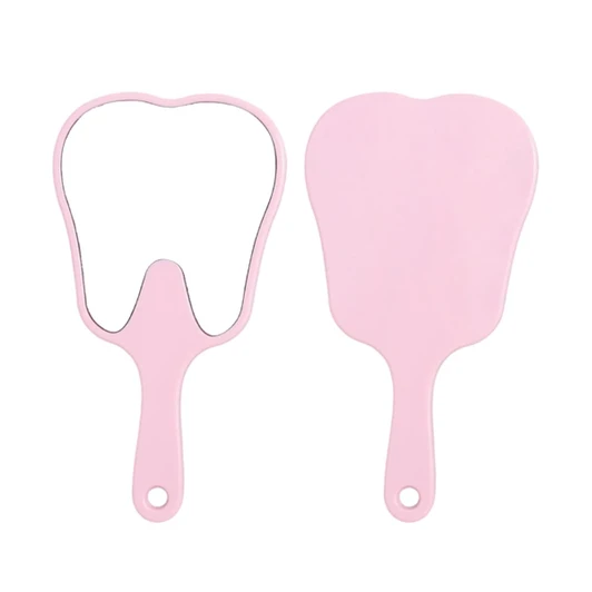 A tooth-shaped face mirror in pink with a handle, featuring a reflective surface on one side.
