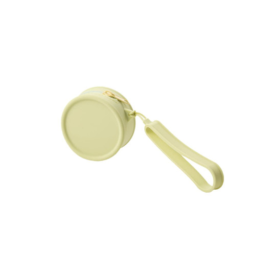 A round silicone coin pouch in a soft green shade with a zip closure and a wrist strap. It features a logo.