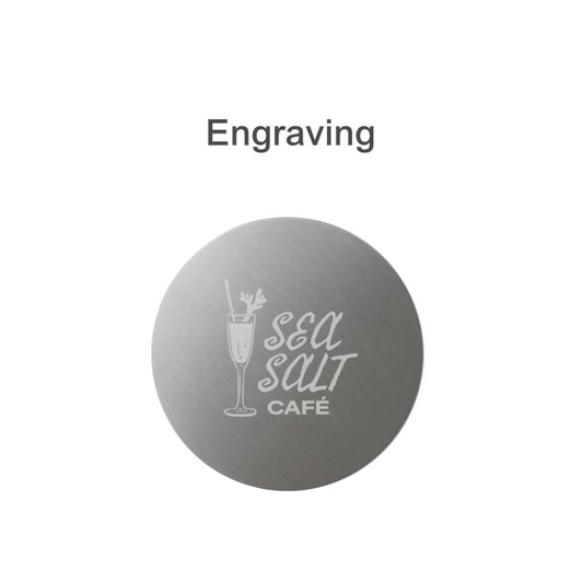 A round metal coaster with a brushed silver finish and a logo engraved on it.
