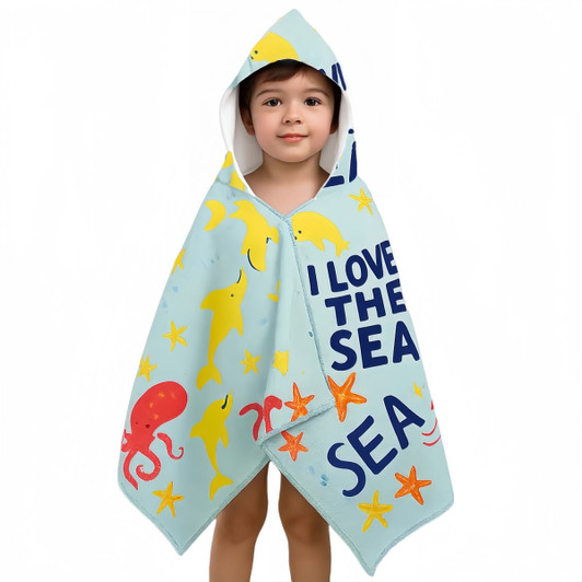 A kids' hooded towel surf shawl in aqua featuring colourful sea creatures and playful text, complete with a hood. 