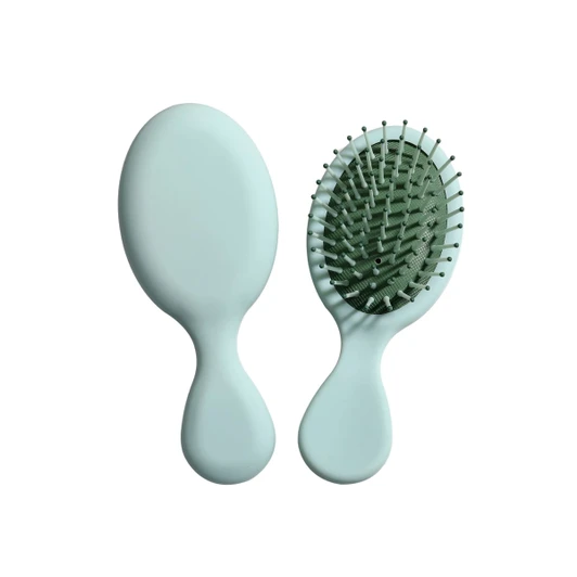 A mini paddle brush in mint green with a smooth handle and flexible bristles. The product has a simple design.