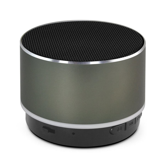 A round Bluetooth speaker in matte grey with a black speaker grill and a silver trim, featuring a branding logo.