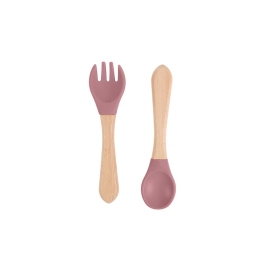 A set of ergonomic silicone kids cutlery featuring a pink fork and scoop with wooden handles.