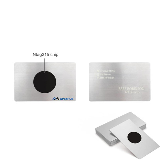 A stainless steel business card with a central black circle, featuring a logo and personal information on one side.
