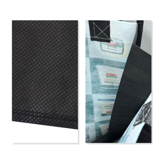 A small tote bag in black with a patterned interior and a logo, showcasing a textured surface.
