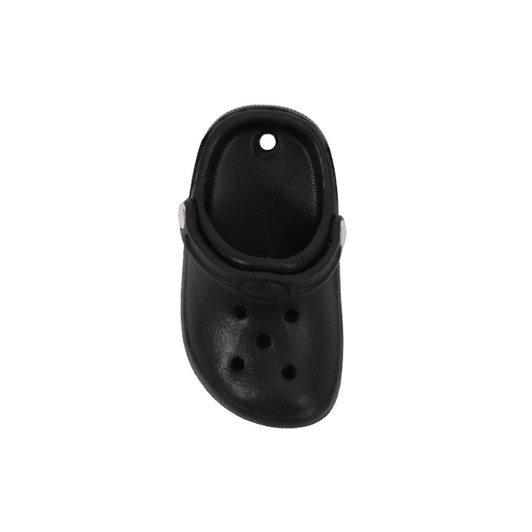 A black clog shoe fridge magnet featuring ventilation holes and a strap, with a circular hole at the top.