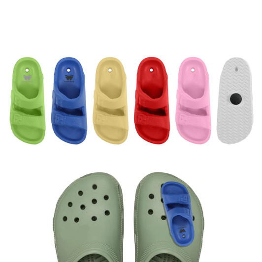 Colourful clog shoe charms displayed in various colours, including blue, yellow, red, pink, and green. A shoe with a charm is featured.