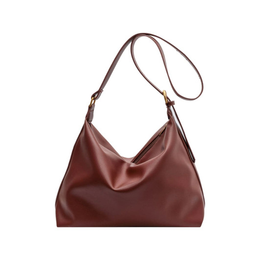 A brown polyurethane tote bag with a slouchy design and a long shoulder strap. It features a small logo.