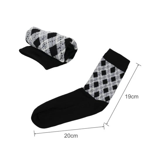 A pair of black and grey patterned socks, one rolled up, showcasing a woven design with a towel bottom.