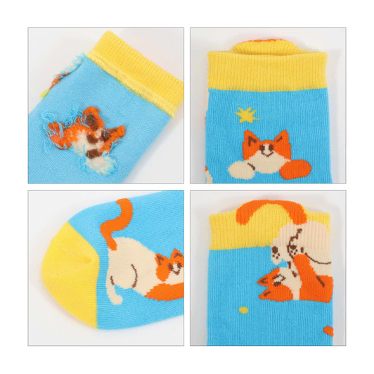 Bright blue socks featuring playful cat designs in orange and yellow, with a yellow cuff and a logo.