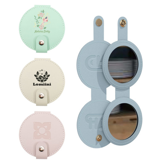 A round folding pocket mirror in pastel colours, featuring a logo on one side and mirrors on both sides.
