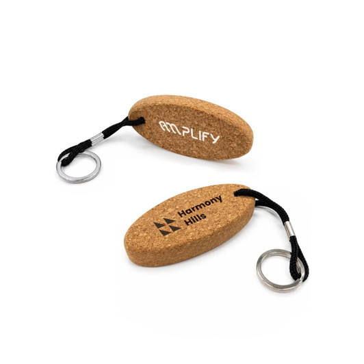 A cork keyring in an oval shape, featuring a black cord and silver keyring attachment. It has branding on both sides.