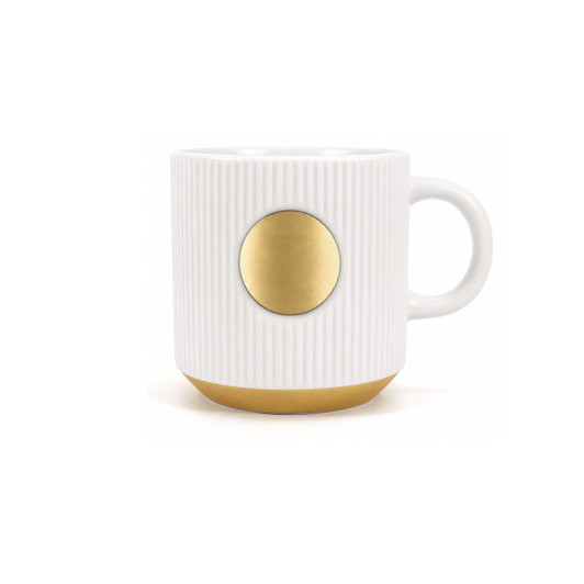 A ceramic coffee mug in white with ribbed texture and a bronze medal accent at the front.
