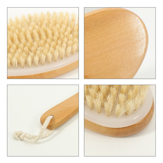 A dry brushing body brush with a wooden handle and natural bristles, featuring a simple design and a hanging rope.