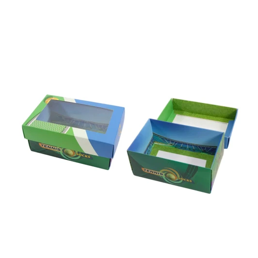 A custom gift box in blue and green with a windowed removable lid, featuring tennis-themed design elements.