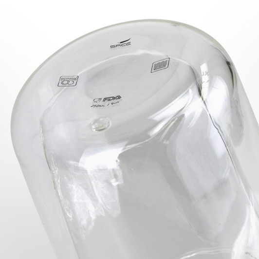 A double wall glass featuring a clear design, holds 250ml, and includes a logo on the base.