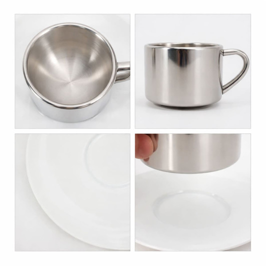 A stainless steel coffee mug with a mirror finish, featuring a handle, displayed on a white plate.