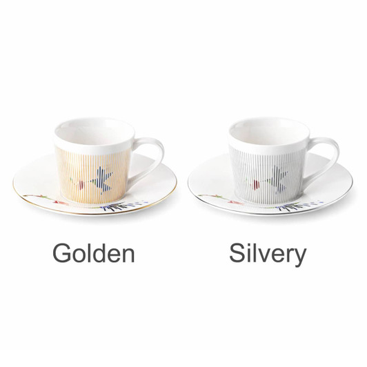 A ceramic coffee mug set in golden and silvery colour with matching saucers. Each mug features a simple design and handle.