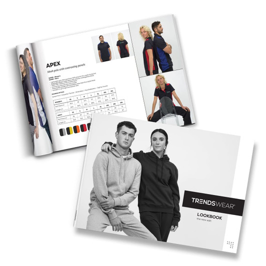 A printed lookbook featuring various clothing styles in black, grey, and colourful designs, along with a branding logo.