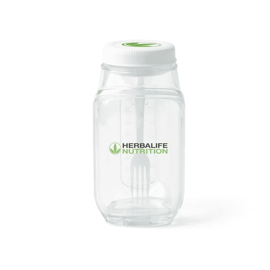 A clear plastic salad jar with a white lid and a branding logo. Features measurement markings on the side.
