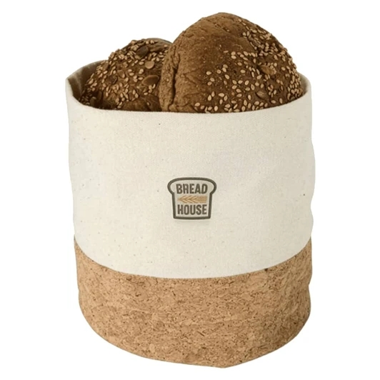 A linen bread basket in white and brown holding sesame seed rolls, featuring a small logo.