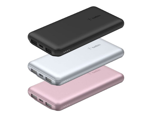 A set of three power banks in black, silver, and rose gold, featuring USB ports and a logo on each.