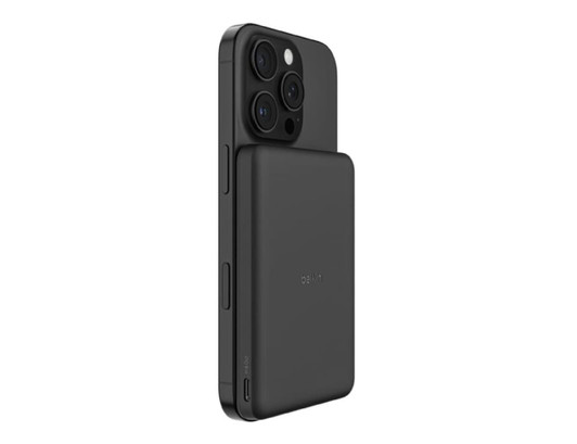 A slim black magnetic power bank attached to the back of a smartphone, featuring multiple camera lenses.