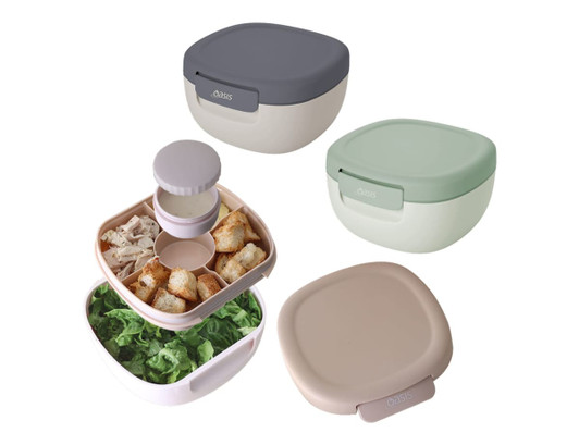 A set of four salad bowls in varying colours, featuring a compartmentalised design and a lid with a logo.