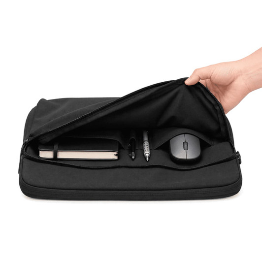 A black laptop sleeve with a zip opening, containing a notebook, pens, and a mouse inside.