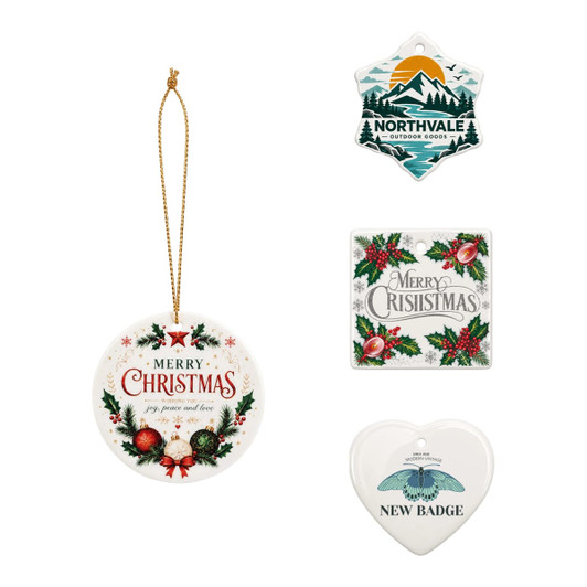 A set of four ceramic ornaments featuring festive designs, including Christmas themes and a heart-shaped ornament.