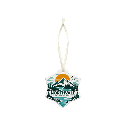 A star-shaped ceramic ornament featuring a mountain landscape design in teal, orange, and green, with a hanging ribbon.