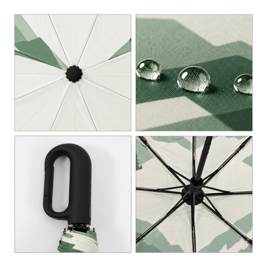 A green and white umbrella featuring a carabiner and a black handle, showcasing water droplets on the fabric and structural details.