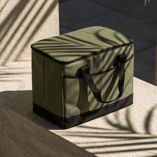 A cooler bag in olive green with black detailing, featuring two handles and a rectangular shape.