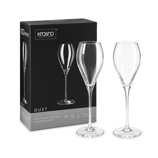 A set of two clear glass champagne flutes with elegant stems, packaged in a branded box.