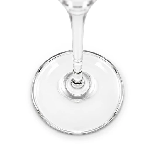 A clear glass flute features an elegant design with a smooth, round base and a slender stem.