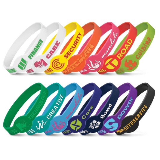 A collection of embossed silicone wristbands in various colours including white, yellow, orange, green, blue, purple, and black, featuring different logos.