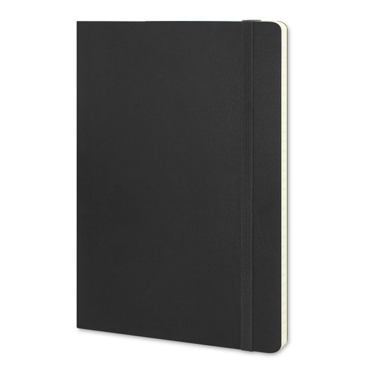 A large black soft cover notebook with an elastic band closure and a cream-coloured interior.