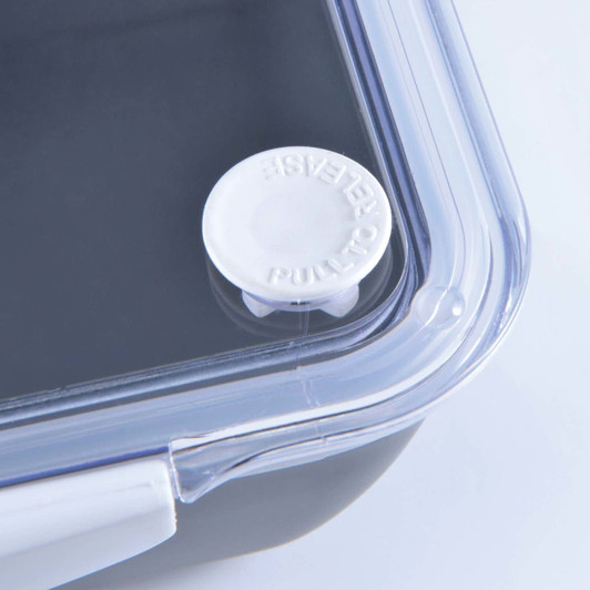 A black food container with a clear lid and a white pull tab for easy opening. It features a logo on the side.