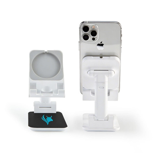 A white phone stand with a circular holder and a square base featuring a logo, supporting a smartphone.