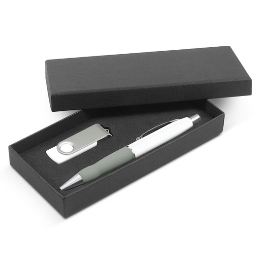 A green and white pen alongside a silver USB drive inside a black gift box.